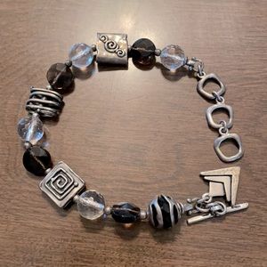Silpada 7.5 inches .925 sterling handmade bracelet. Smoky Topaz and Crystal.